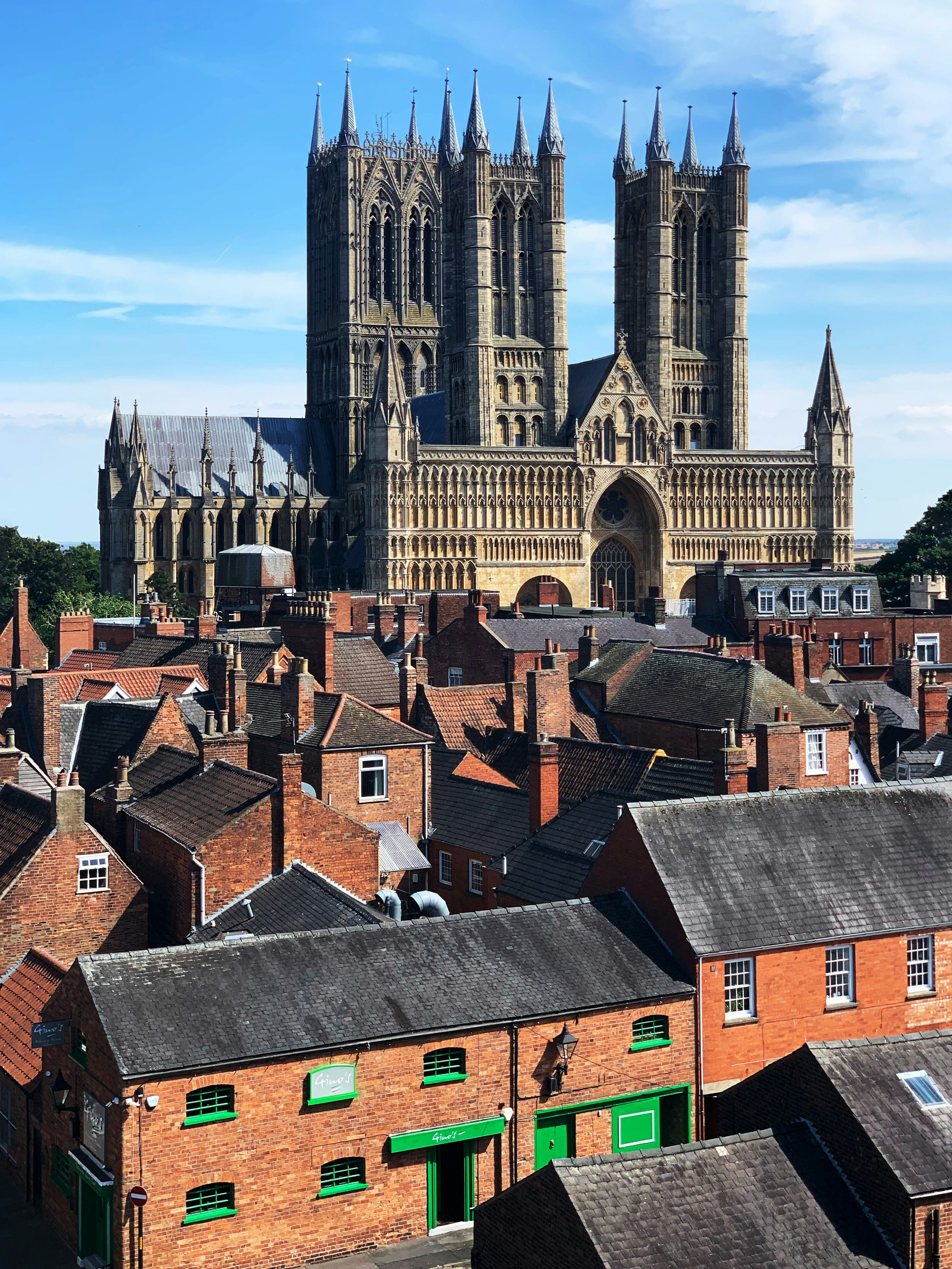 Summer aerial context view of Lincoln Cathedral and the city